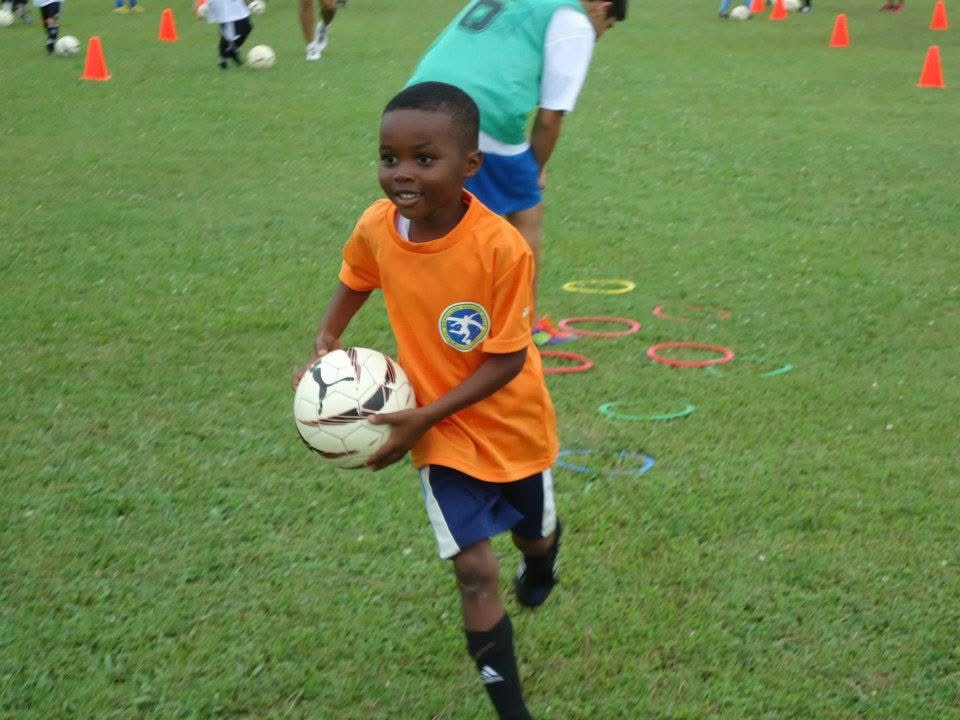 BSC Summer Camp 2012 — young camper with ball on the field