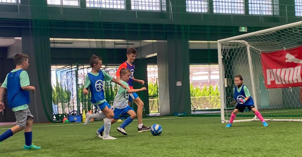 BSC Summer Camp 2022 — campers playing a small-sided game on the indoor field